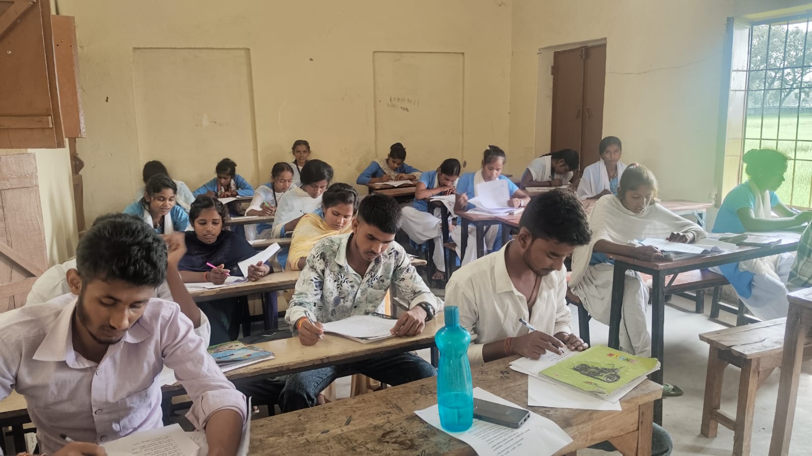 Candidates working on their examination papers — Barhara, 2025