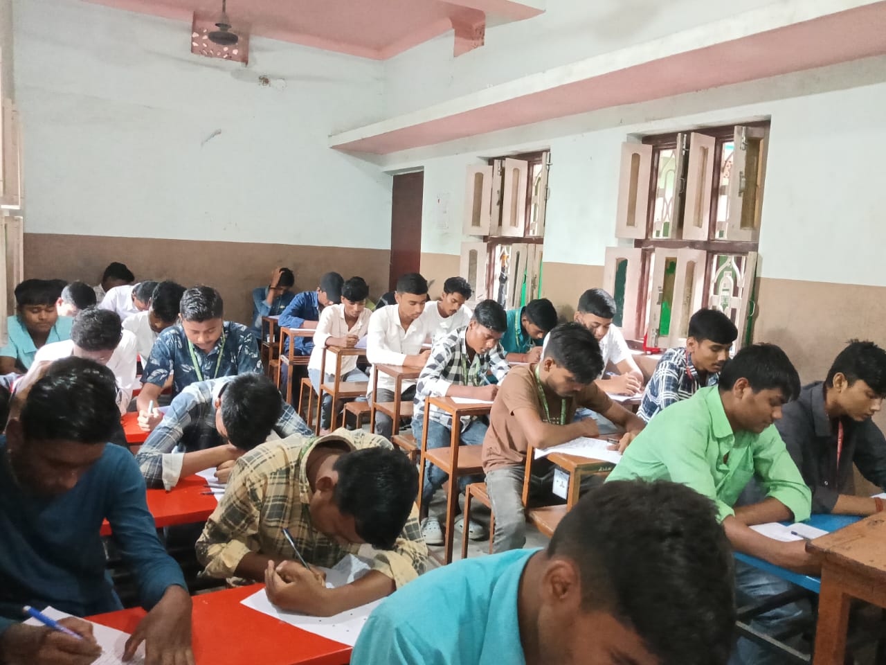 Candidates working on their examination papers — Nirmali